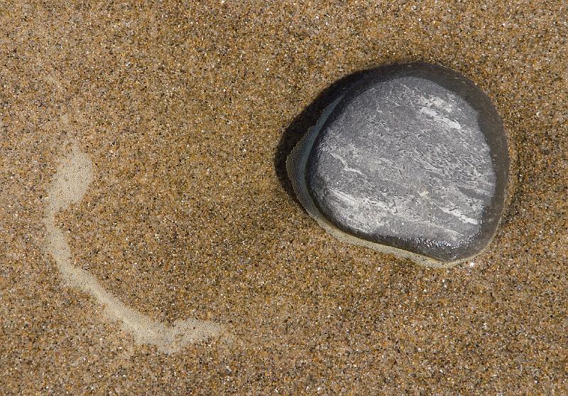Coast-17A.jpg - On the beach at Lincoln City a small stone and seafoam contrast with the sand.