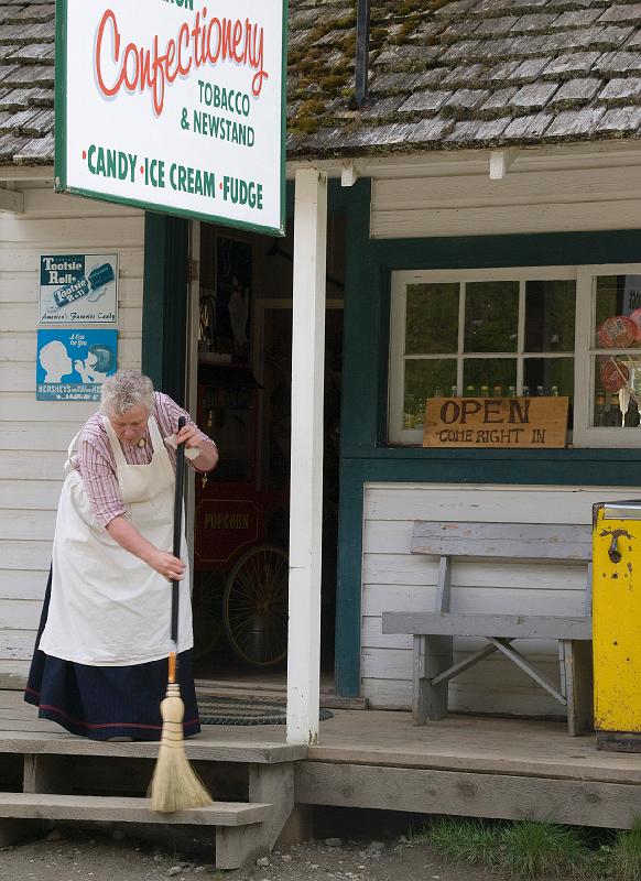 Day-30-040A.jpg - A Barkerville shopkeeper sweeps her steps.
